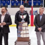 UGIC CEO Matthew Wight( (left), Metalfab Ltd. Business Development Manager Ryan Stacey (middle), and MHL Commissioner Matt Moore stand around the Metalfab MHL Cup (Photo: Percy Picard)