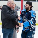 Metalfab Ltd. Business Development Manager Ryan Stacey (left) and MHL Commissioner Matt Moore (middle) shake hands with Edmundston Blizzard forward Carl-Anthony Massé (Photo: Percy Picard)